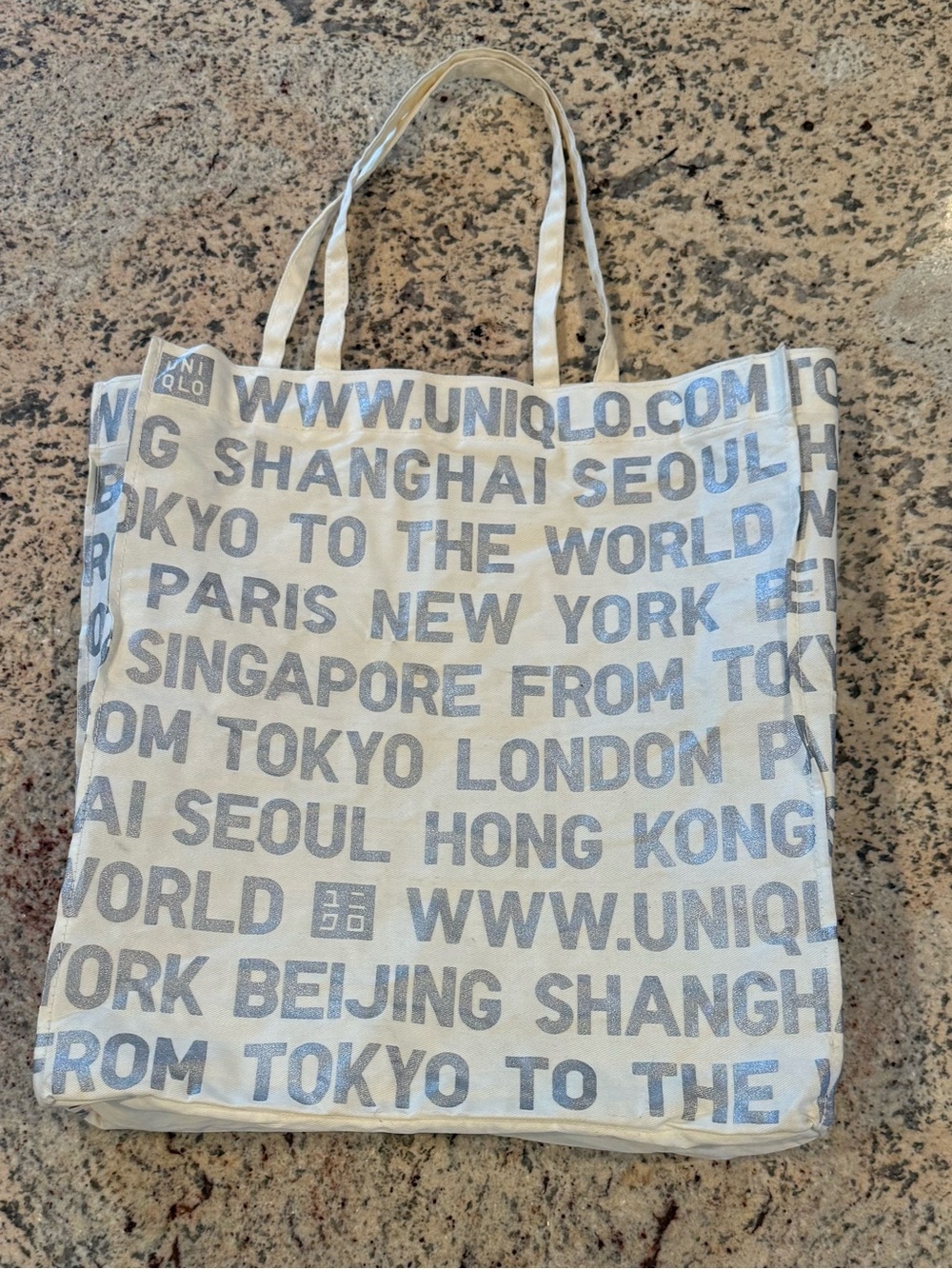 UNIQLO Cream City Series Canvas Tote with Silver Text